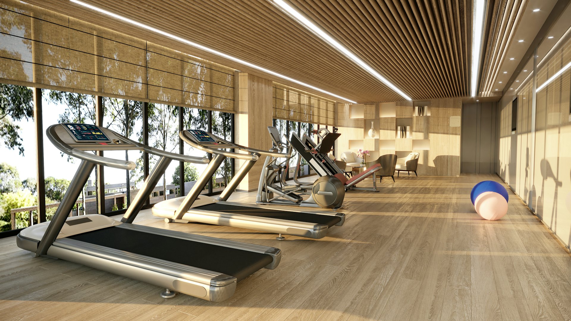 Koşu bantları ve geniş pencereleriyle modern spor salonu